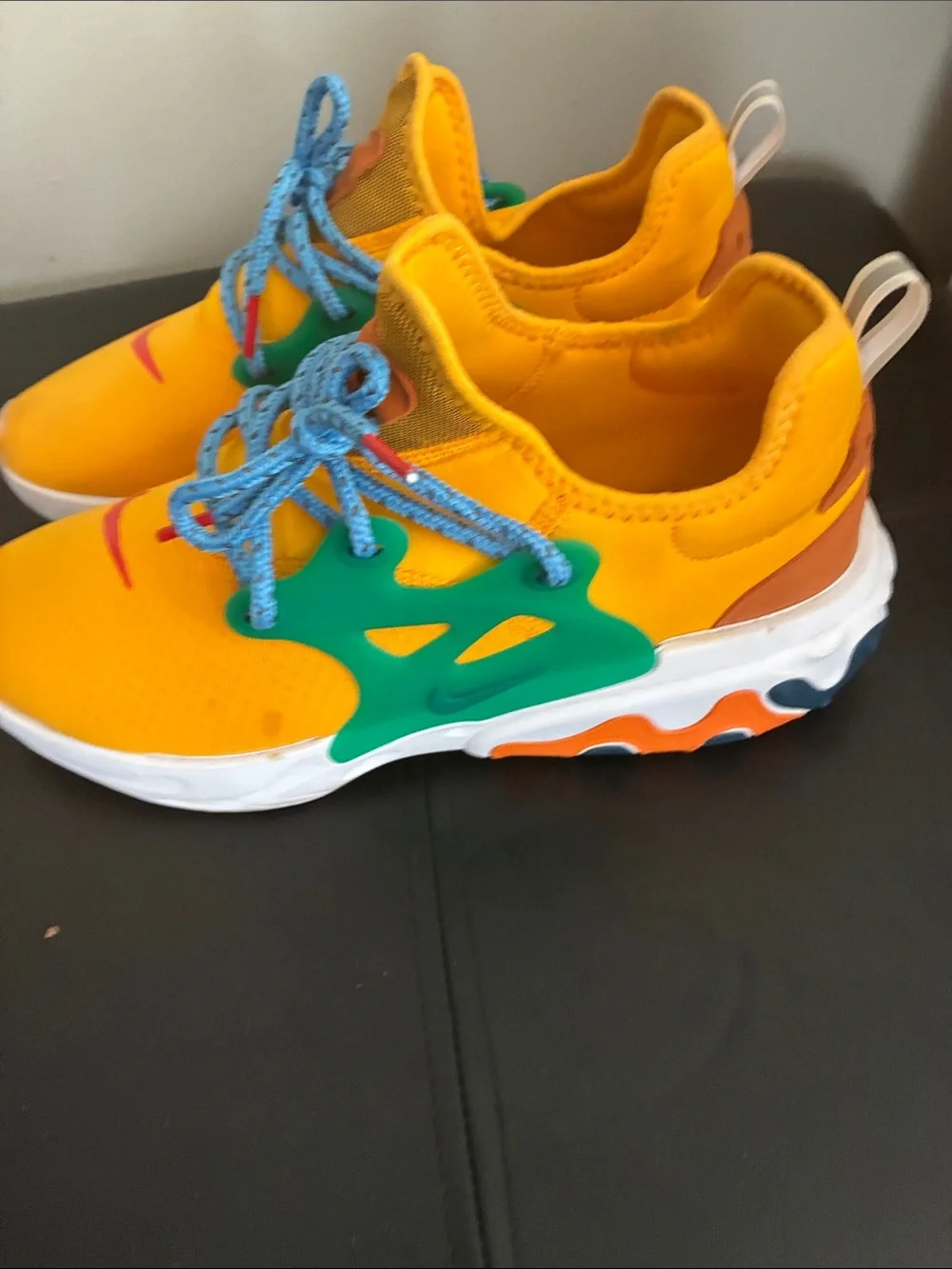Nike Kids Yellow Sneakers with Blue Laces and Green Accents